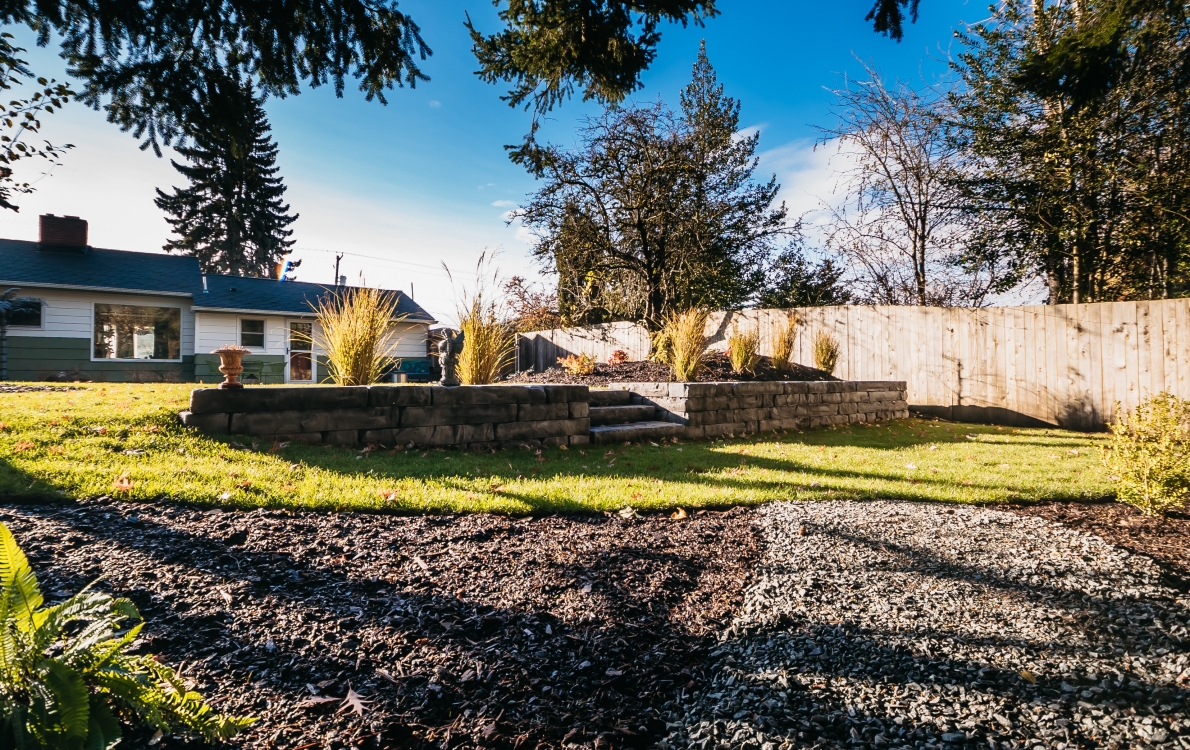 landscaping and paver patio backyard